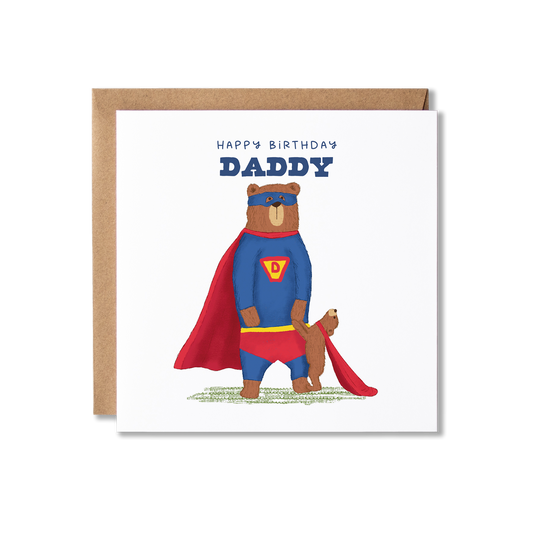 Birthday card with illustration of a bear standing on back legs wearing a blue and red super hero costume, with a bear cub stood in front holding his hand wearing a red cape and another cub on his shoulder in a blue eye mask, with the message Happy Birthday Daddy.