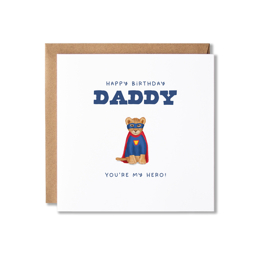 Birthday card with illustration of two lion cubs sat, one in a red cape and blue mask and the other in a blue super hero jumper and yellow mask with the message Happy Birthday Daddy You're Our Hero.