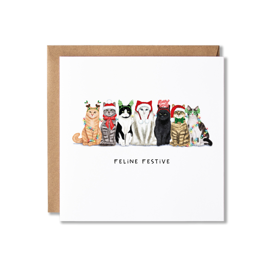 Christmas card with illustration of a group of cats sat in a row, wearing different Christmas hats and wrapped in Christmas lights with the message Feline Festive underneath.