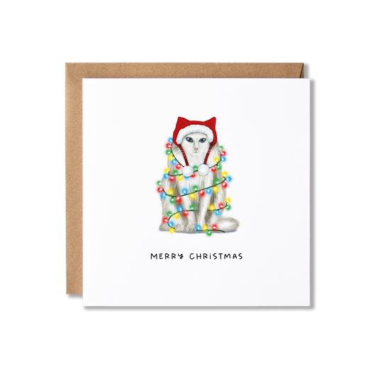 Christmas card with illustration of a ragdoll cat wrapped in Christmas lights with the message Merry Christmas underneath.