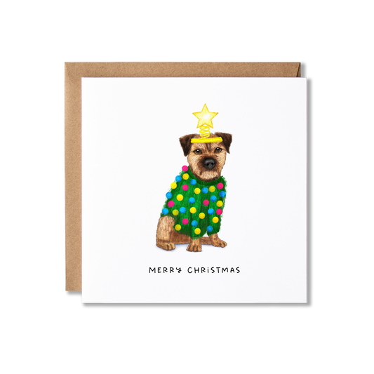 Christmas card with illustration of a Border Terrier dog in a green Christmas jumper with multi-coloured pom poms on and a yellow headband with a star on top, so it looks a bit like a Christmas tree, with the message Merry Christmas.