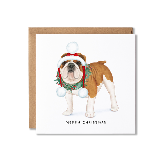 Christmas card with illustration of a bulldog in a Santa hat that has dangling white pom poms each site and wearing a Christmas wreath with the message Merry Christmas.
