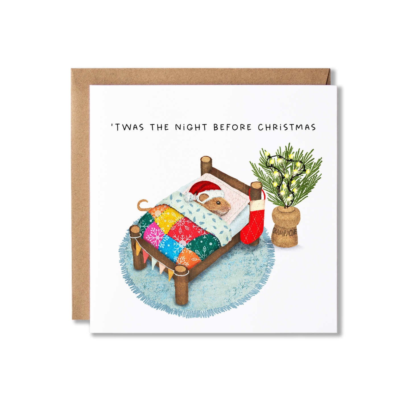Christmas card with illustration of a mouse wearing a Santa hat in a bed with a colourful blanket lying next to a cork that has sprigs of Christmas tree and festoon lights in it, with the message T'was the Night before Christmas.