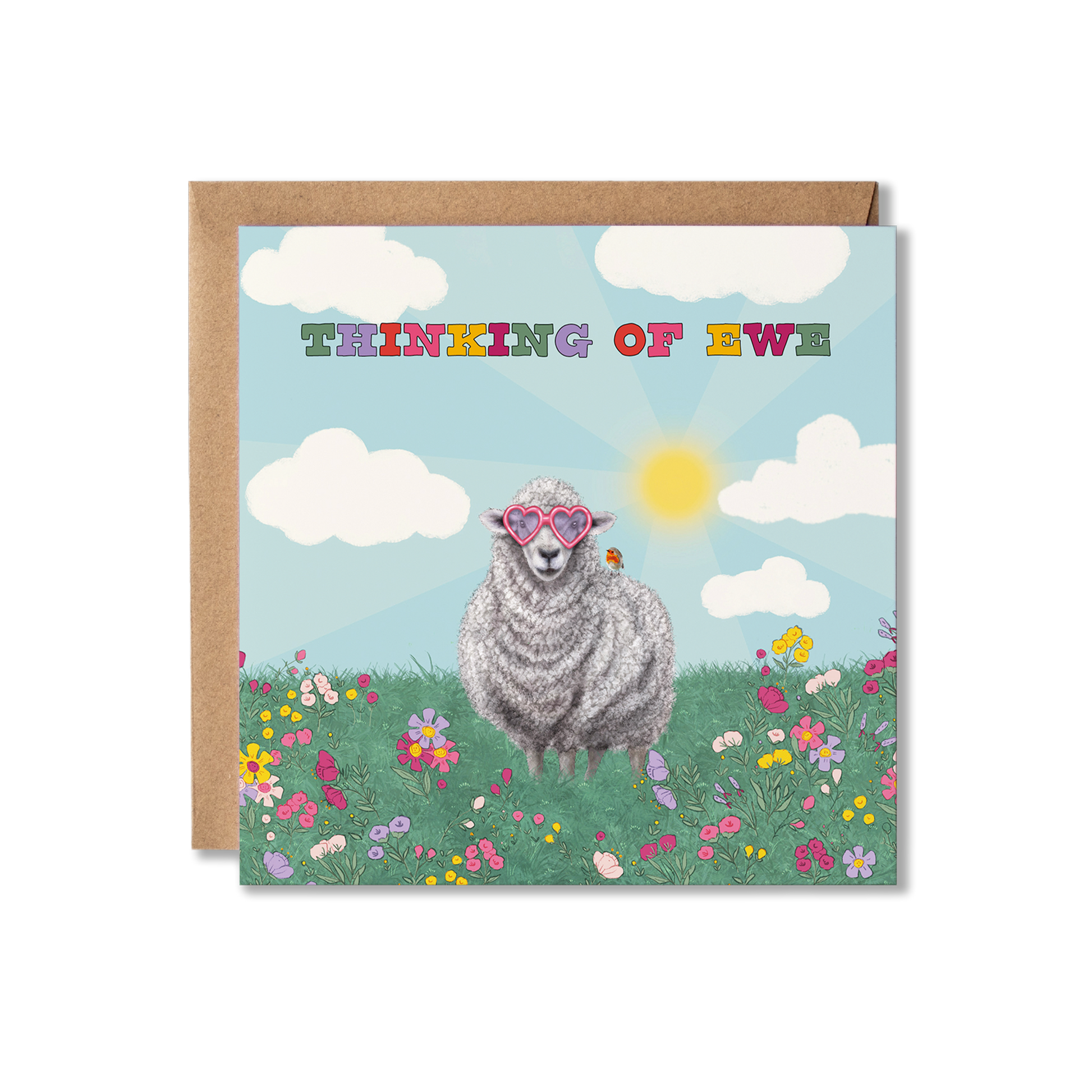 Card with a sheep wearing heart shape glasses in a field of flowers and clouds, with 'Thinking of Ewe' text.