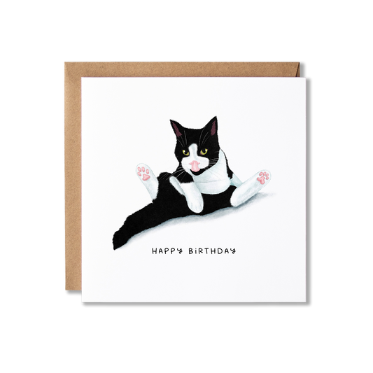 Birthday card with illustration of a black and white cat sat in a funny position having a wash with the message Happy Birthday.
