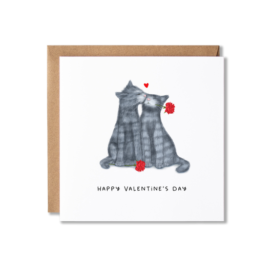 Illustration of a pair of grey tabby cats kissing with red roses and the words Happy Valentine's Day underneath.
