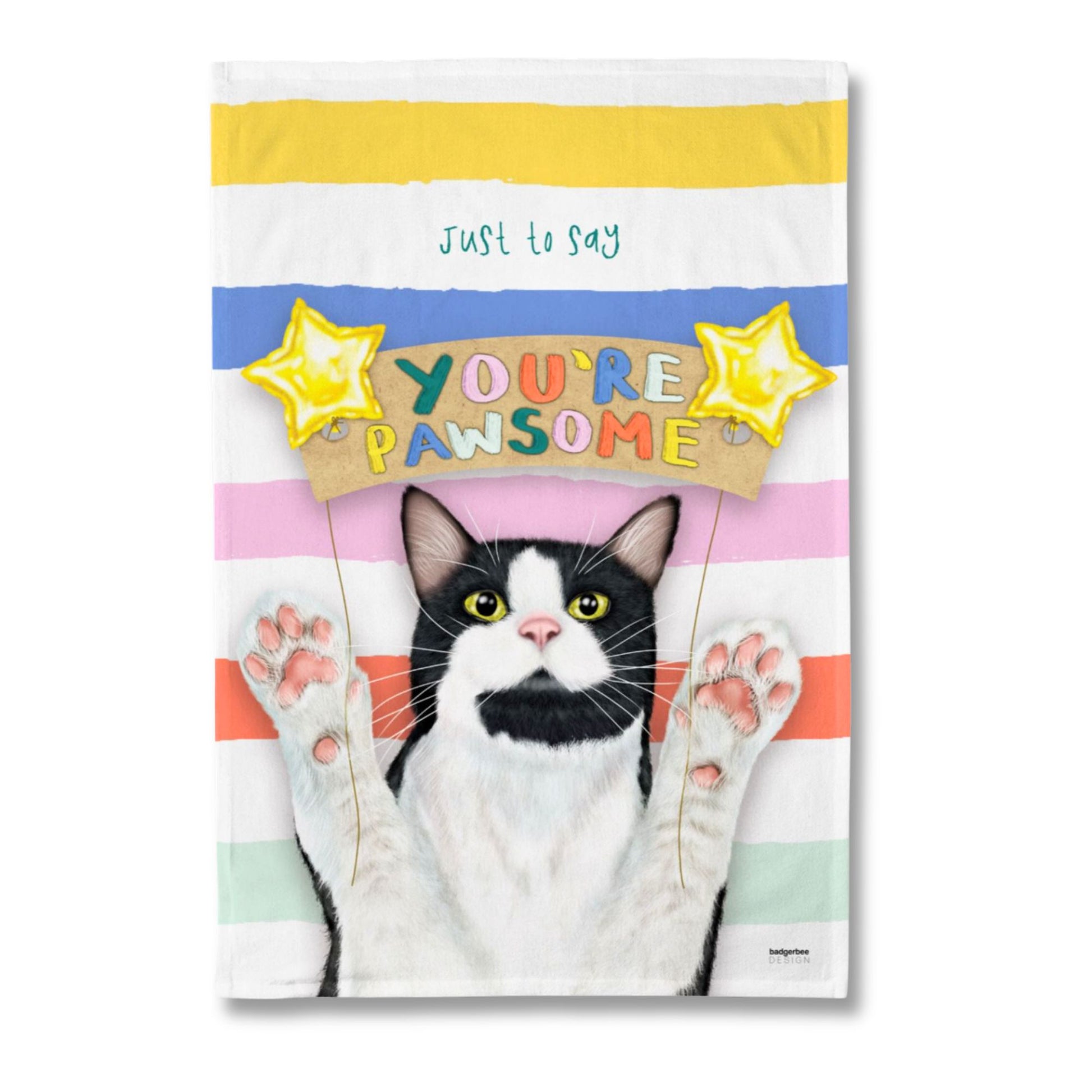 A rectangular printed tea towel featuring a black-and-white cat with raised paws against pastel horizontal stripes, with the phrase 'just to say YOU'RE PAWSOME' and yellow star graphics. The product is photographed alone on a plain white background.