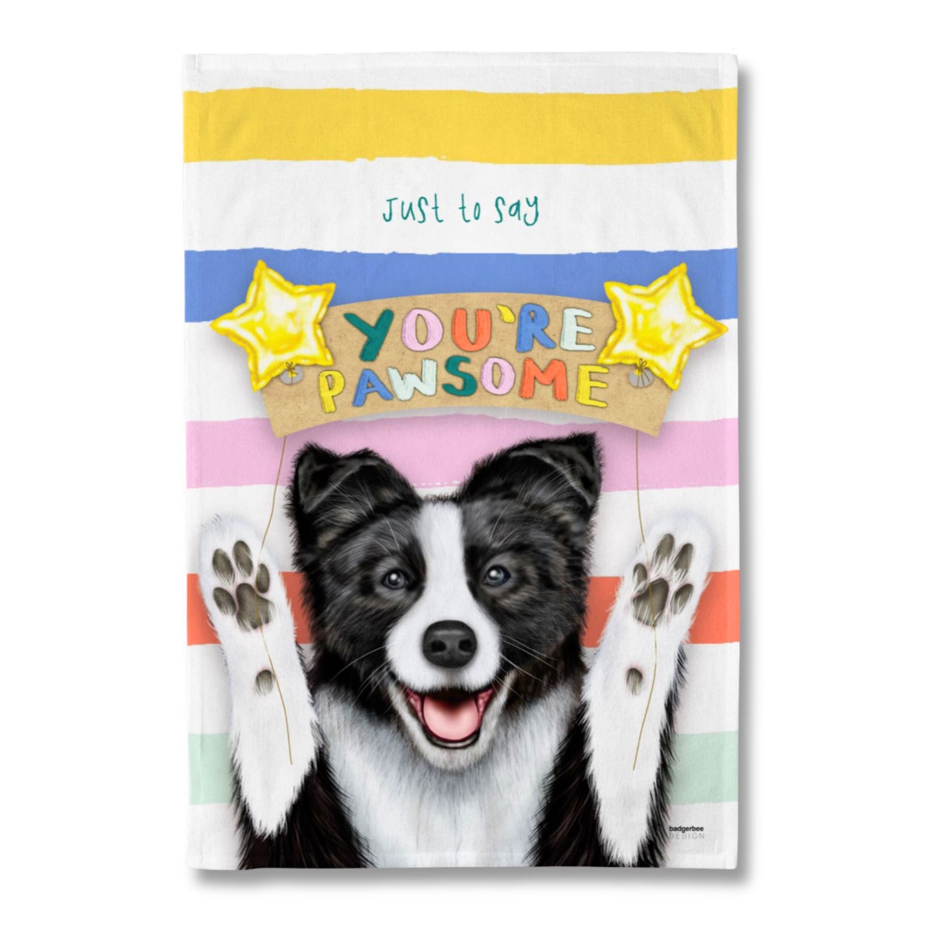 A rectangular tea towel with a colourful striped background and a black-and-white dog face with raised paws. The text reads 'just to say YOU'RE PAWSOME' with two yellow stars above, on a plain white background.