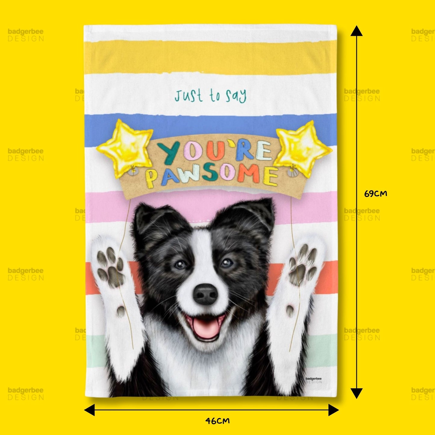A rectangular printed tea towel shown flat against a bright yellow background, with dimension arrows and labels indicating 69 cm tall by 46 cm wide. The design features a black-and-white dog face and raised paws on a pastel striped background with the phrase 'just to say YOU'RE PAWSOME' and two yellow stars.
