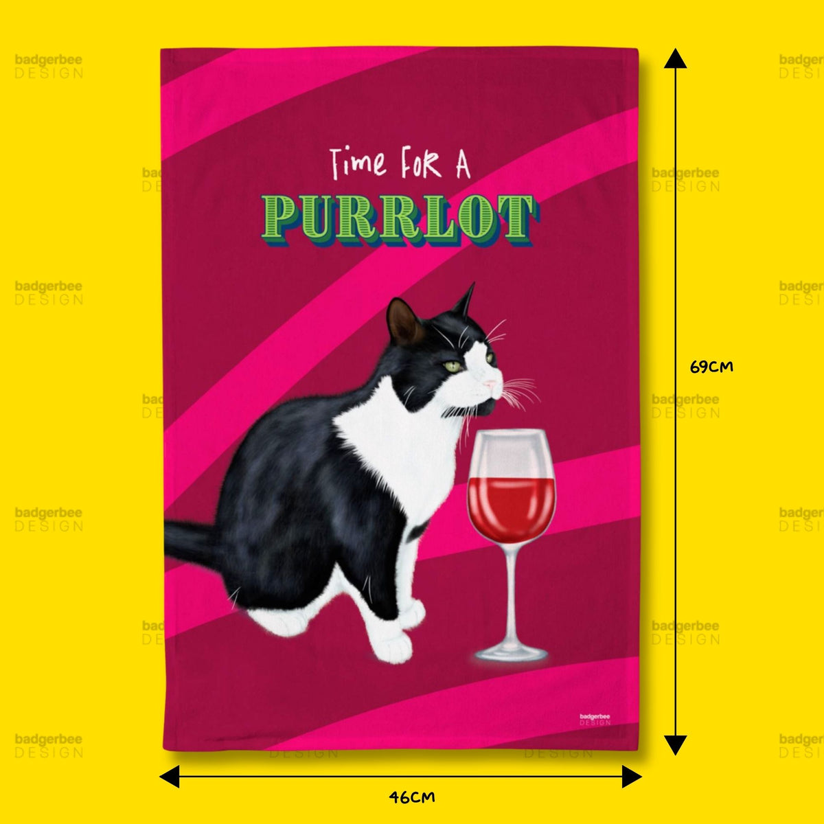 A rectangular printed tea towel shown against a bright yellow background, with dimension arrows and labels indicating 69 cm tall by 46 cm wide. The design features a black-and-white cat beside a glass of red wine on a bright pink striped background, with the text 'Time FOR A PURRLOT' at the top.