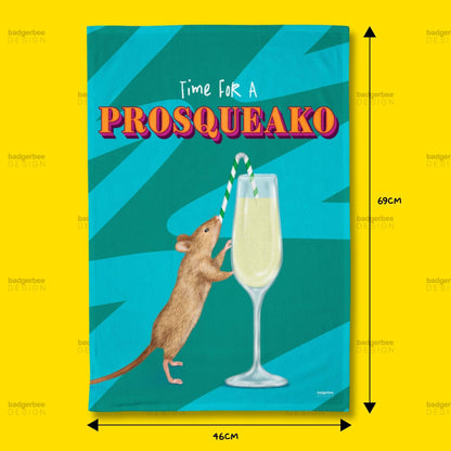 A rectangular printed Tea Towel shown on a bright yellow background, with dimension arrows and labels indicating 69 cm height and 46 cm width. The artwork features the text 'Time For A PROSQUEAKO' above an illustration of a small brown mouse reaching toward a tall glass of pale yellow drink with a striped straw on a teal abstract background.