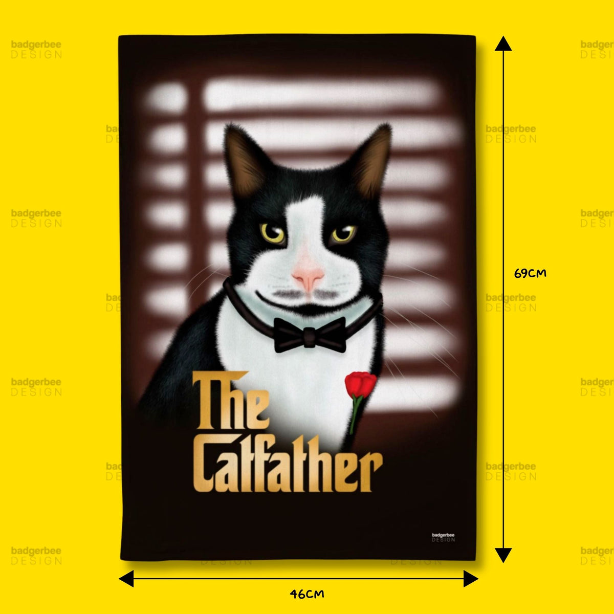 A rectangular printed tea towel featuring a black-and-white cat in a bow tie holding a red rose, with the text 'The Catfather' in gold. The print is shown against a bright yellow background with black dimension arrows and labels indicating 69 cm height and 46 cm width.