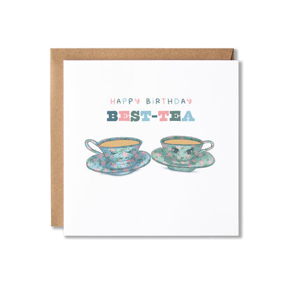 A square birthday card with a kraft envelope, featuring the text 'HAPPY BIRTHDAY BEST TEA' above an illustration of two smiling teacups on saucers.