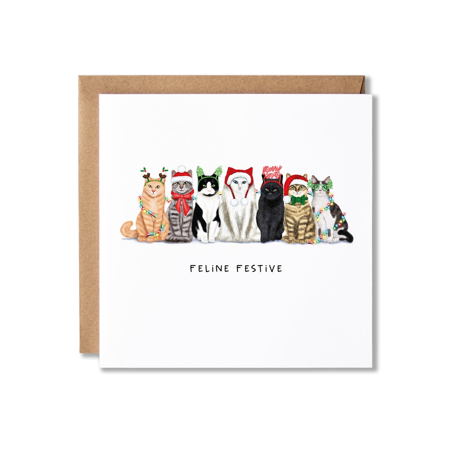 A square greeting card with a brown kraft envelope behind it, featuring an illustration of seven cats wearing Christmas hats and scarves, with the text 'FELINE FESTIVE' below them, on a white background.