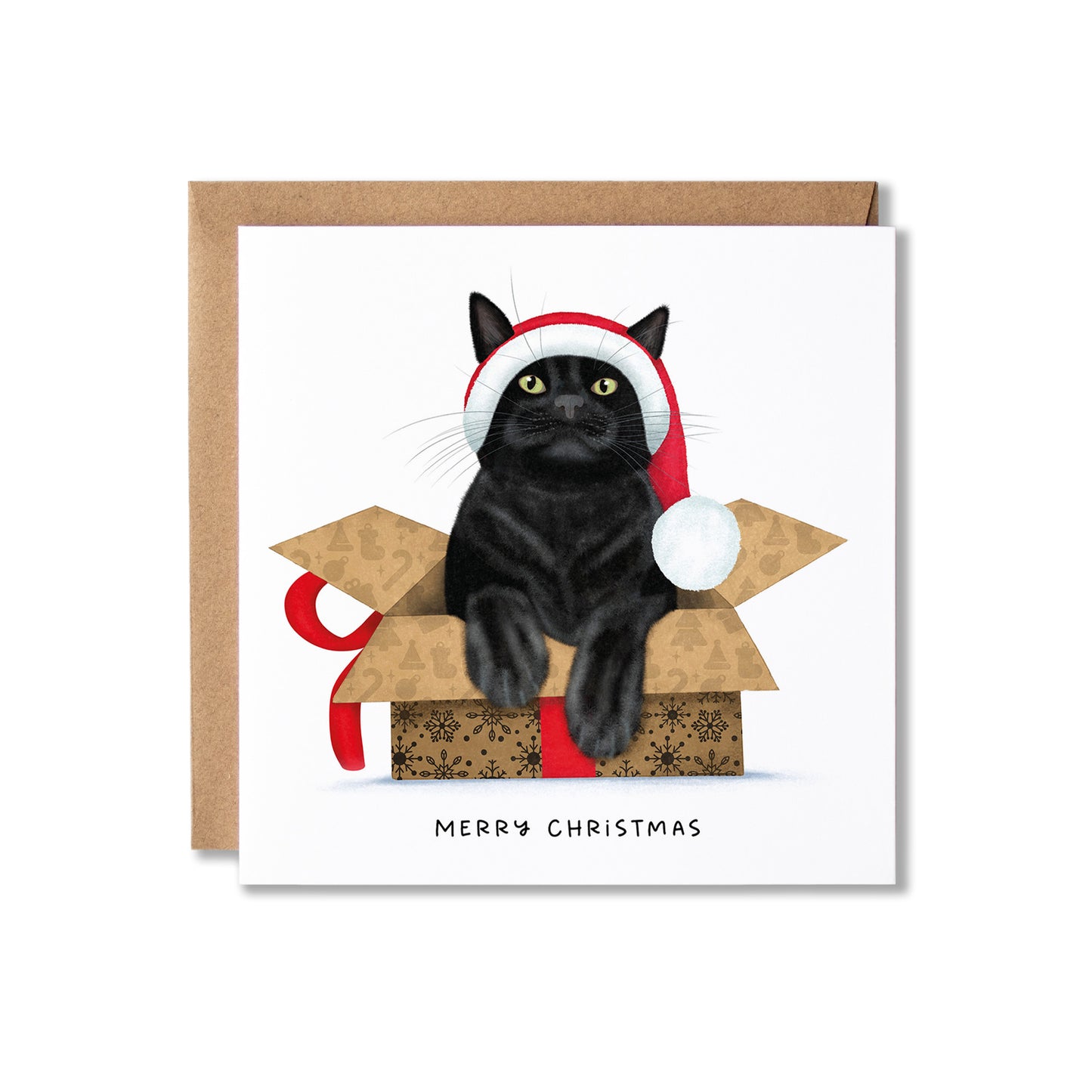 A square Christmas greeting card with a brown kraft envelope behind it. The card features an illustration of a black cat wearing a red and white Santa hat, sitting inside a gift box with a red ribbon, and the text 'MERRY CHRISTMAS' printed below.