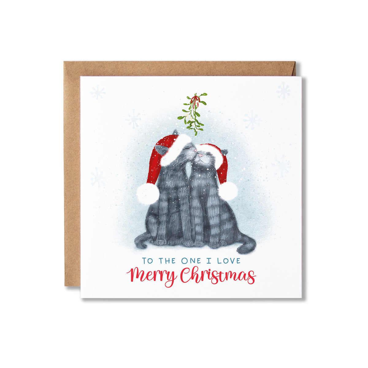 A square Christmas greeting card with a kraft envelope behind it. The card features an illustration of two gray cats wearing red Santa hats and kissing, with mistletoe between them and the text 'TO THE ONE I LOVE Merry Christmas' below.