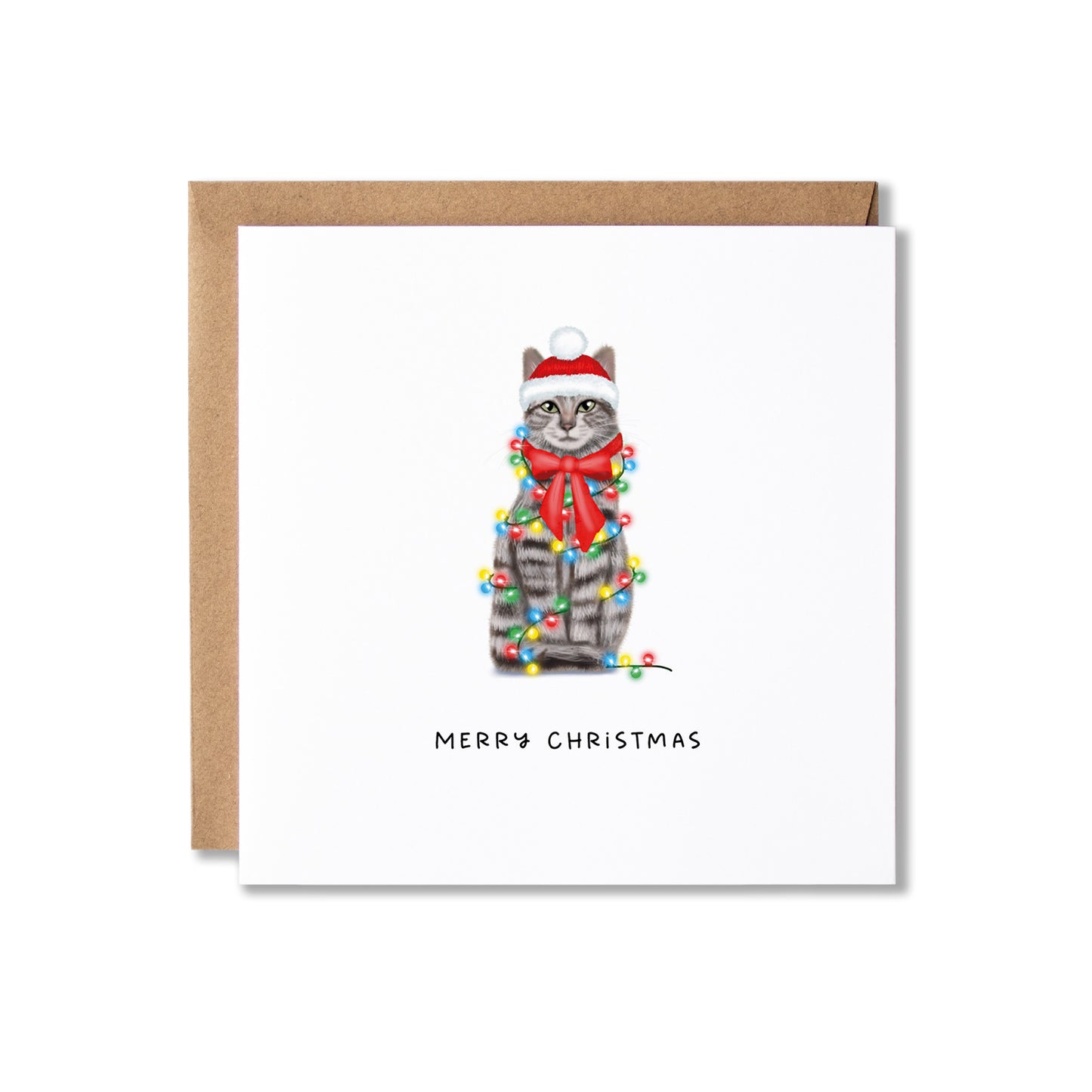 A square white Christmas greeting card with a brown kraft envelope behind it. The card features an illustration of a gray tabby cat wearing a red Santa hat and red bow tie, wrapped in multicolored Christmas lights, with the text 'MERRY CHRISTMAS' below.