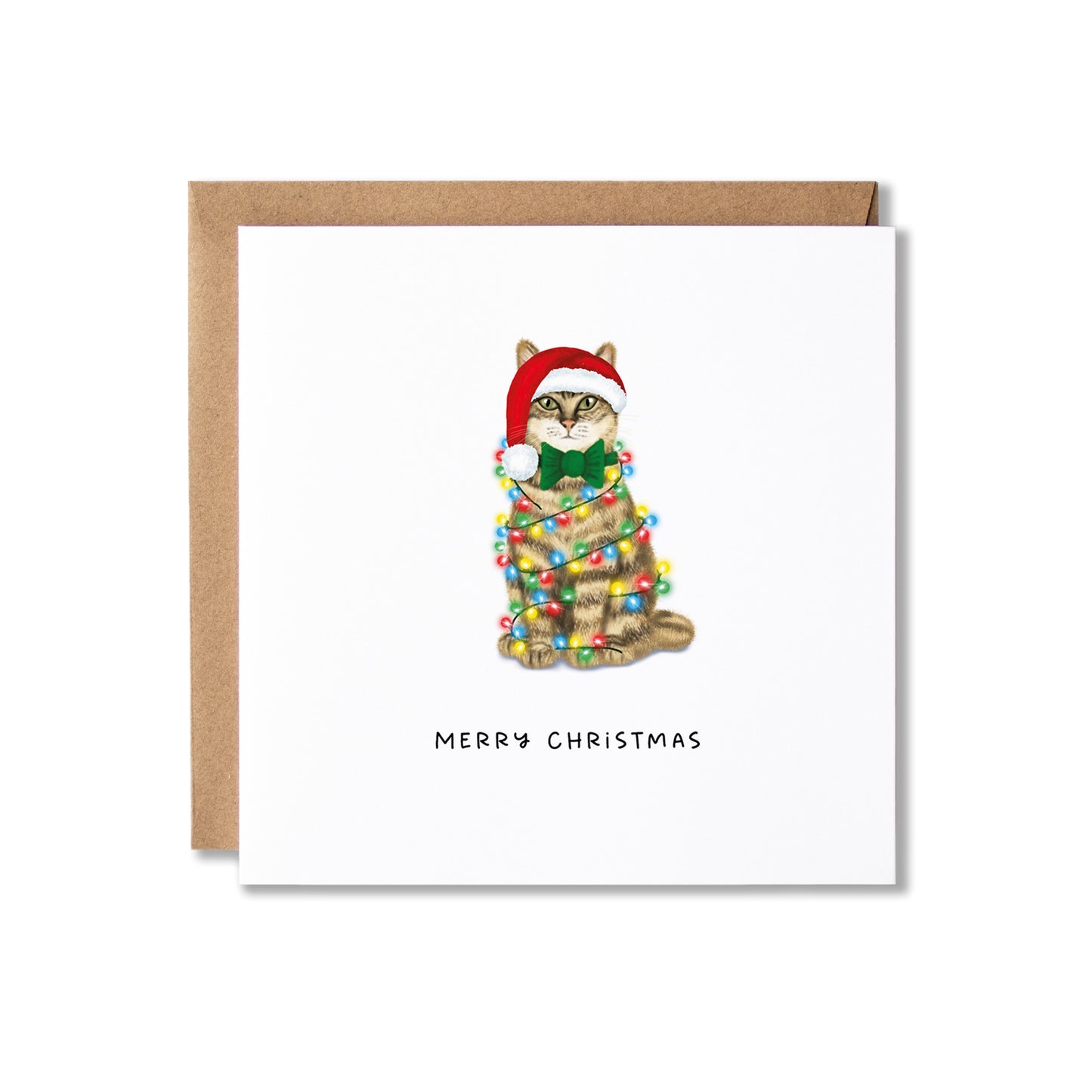 A square white Christmas greeting card with a brown kraft envelope behind it. The card features an illustration of a tabby cat wearing a red Santa hat and green bow tie, wrapped in multicolored Christmas lights, with the text 'MERRY CHRISTMAS' below.