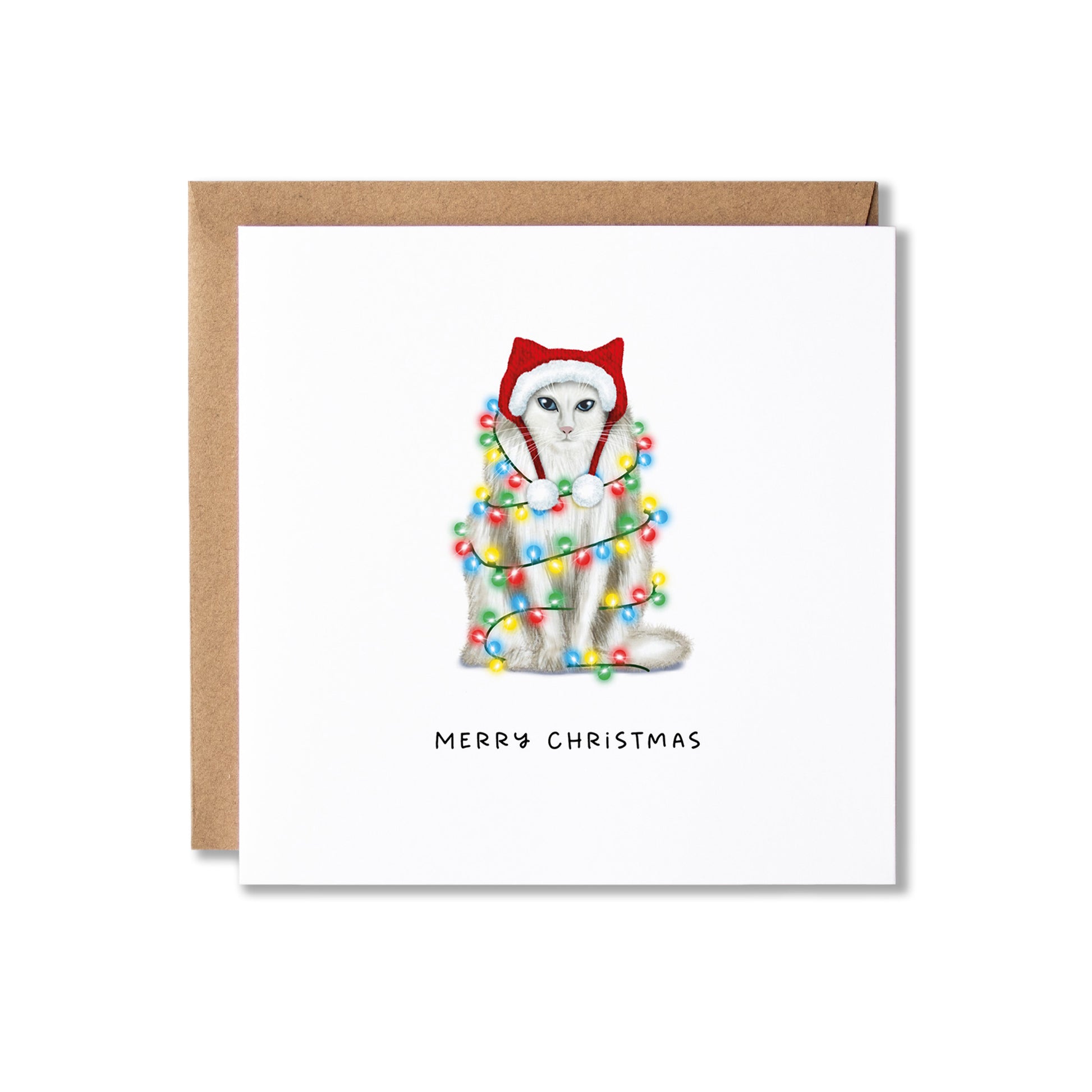 A square Christmas greeting card with a white front, featuring an illustration of a white cat wearing a red Santa hat and wrapped in multicolored holiday lights. The card is shown with a brown kraft envelope behind it on a white background.
