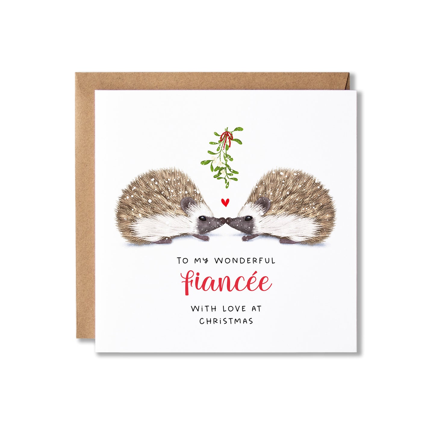 A square Christmas greeting card with a kraft envelope behind it, featuring an illustration of two hedgehogs facing each other under a sprig of mistletoe, with the text 'TO MY WONDERFUL fiancée WITH LOVE AT CHRISTMAS' on a white card background.