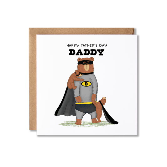 Father's Day card with illustration of a bear stadning on back legs wearing a grey and black super hero costume, with a bear cub stood in front holding his hand wearing a black cape and another cub on his shoulder in a black eye mask, with the message Happy Father's Day Daddy.