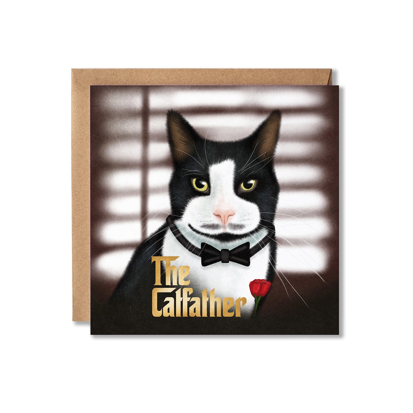 A square greeting card featuring an illustrated black-and-white cat in a tuxedo with a bow tie and a red rose, with the text 'The Catfather' in gold. A kraft paper envelope is placed behind the card on a white background.