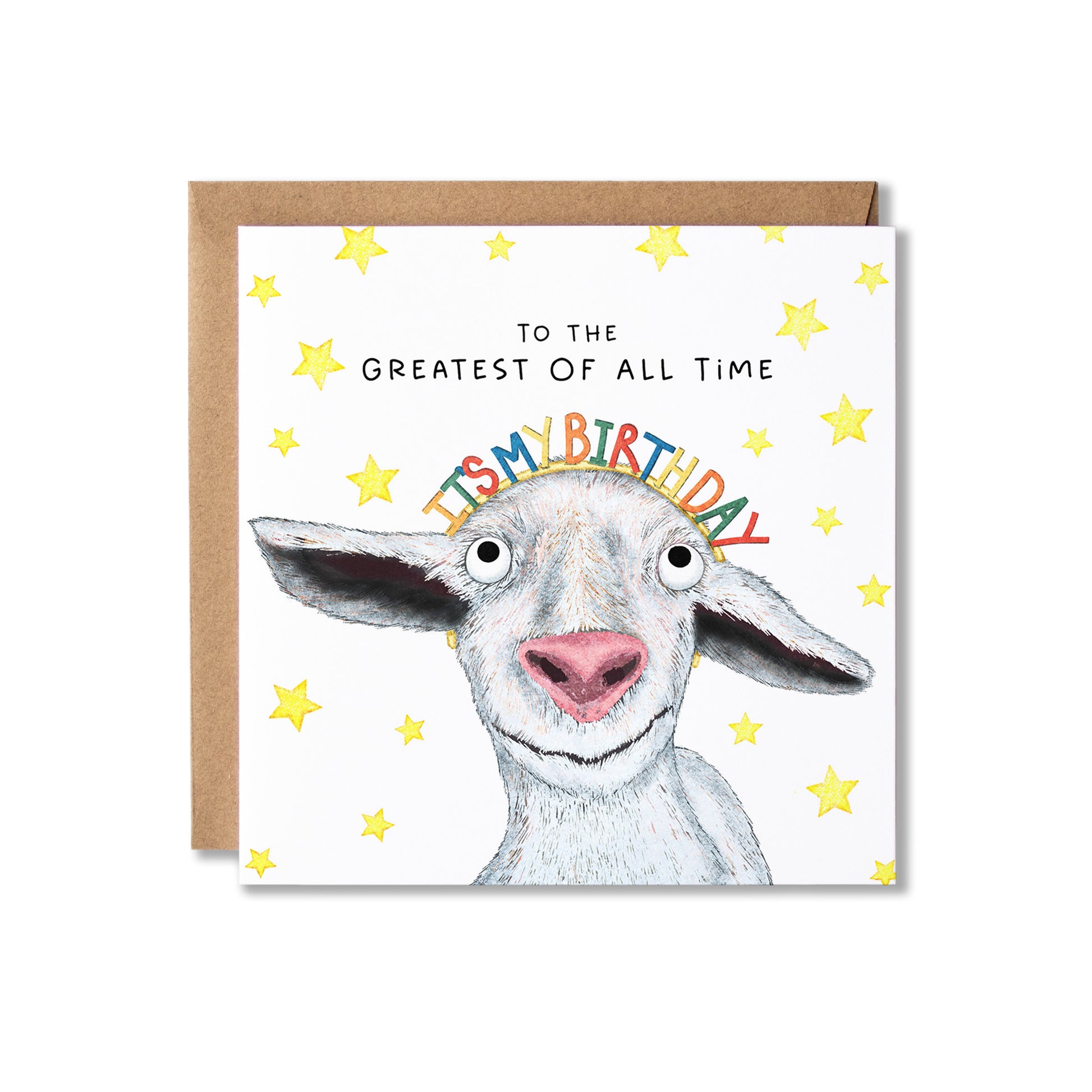 A square greeting card with a brown envelope behind it, featuring a white goat illustration, yellow stars, and the text 'TO THE GREATEST OF ALL TIME IT'S BIRTHDAY' on a white background.
