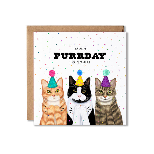 A square greeting card with a brown envelope behind it, featuring three illustrated cats wearing party hats and the text 'HAPPY PURRDAY TO YOU!!!' on a white background with scattered confetti.