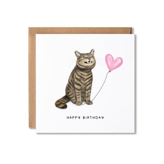 Birthday card with illustration of a tabby cat sat grinning  holding a pink heart ballon the message Happy Birthday.