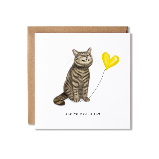 Birthday card with illustration of a tabby cat sat grinning  holding a yellow heart ballon the message Happy Birthday.