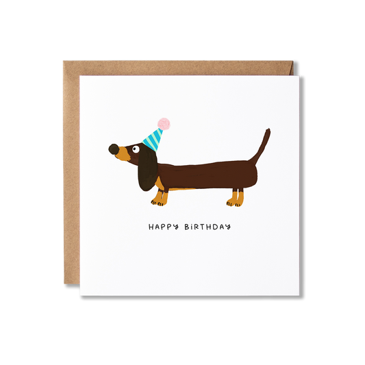 Birthday card with illustration of a dachshund sausage dog with a party hat on and underneath the message Happy Birthday.