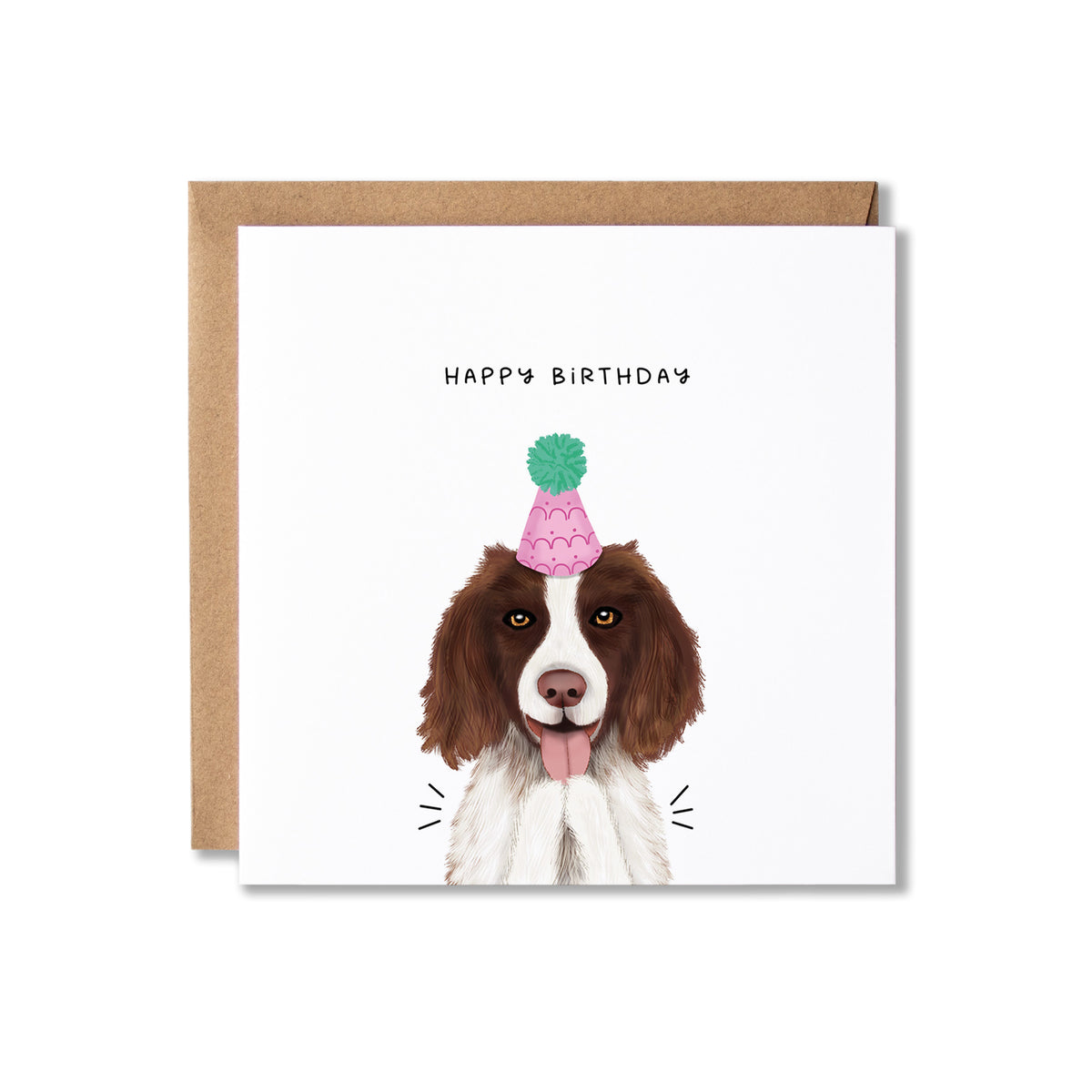 A square white birthday card with a brown envelope behind it, featuring an illustration of a brown and white dog wearing a pink party hat with a green pom-pom. The text 'HAPPY BIRTHDAY' appears above the dog.