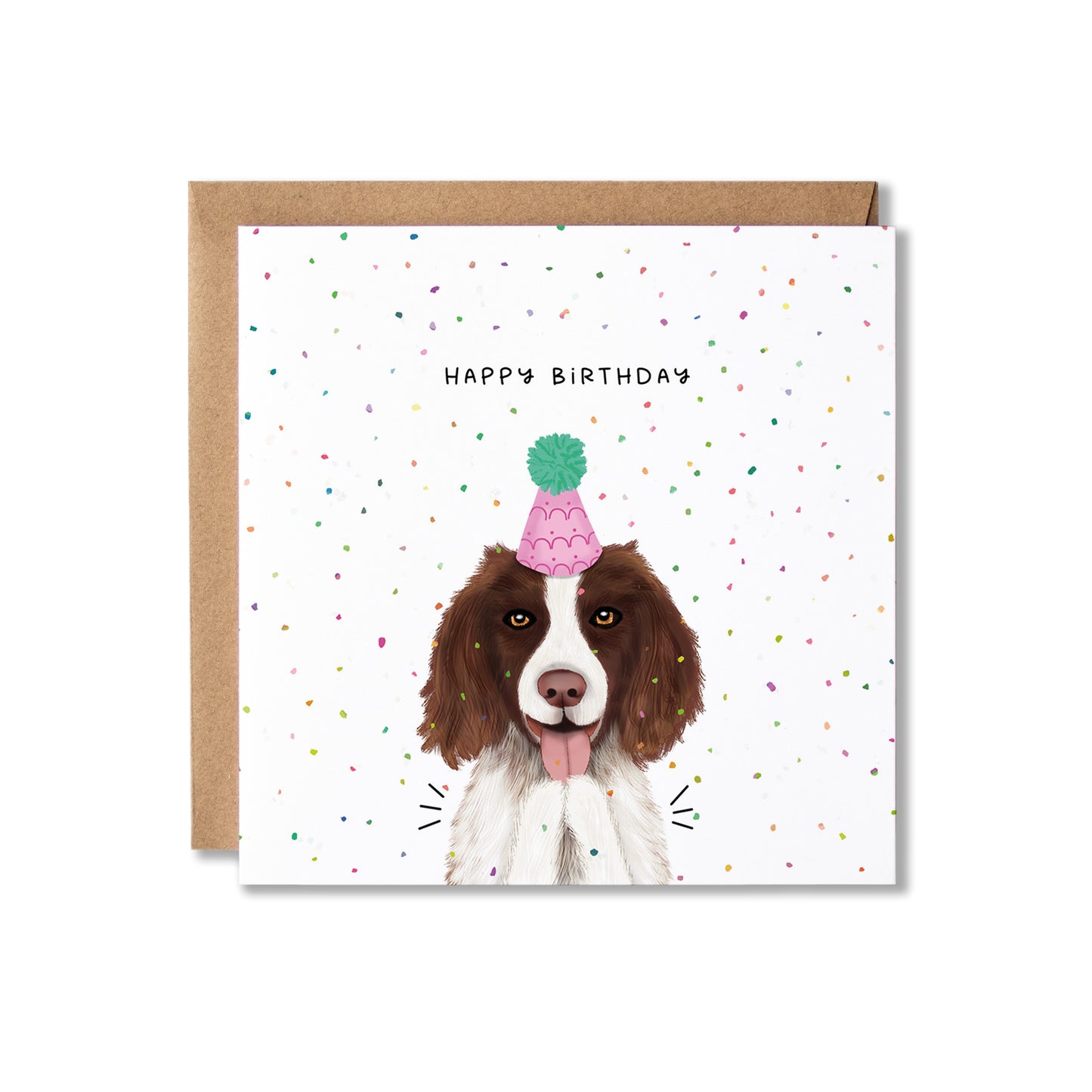 A square birthday card with a brown envelope behind it, featuring an illustration of a brown and white dog wearing a pink party hat with a green pom-pom. The card is decorated with small multicolored confetti and reads 'HAPPY BIRTHDAY'.