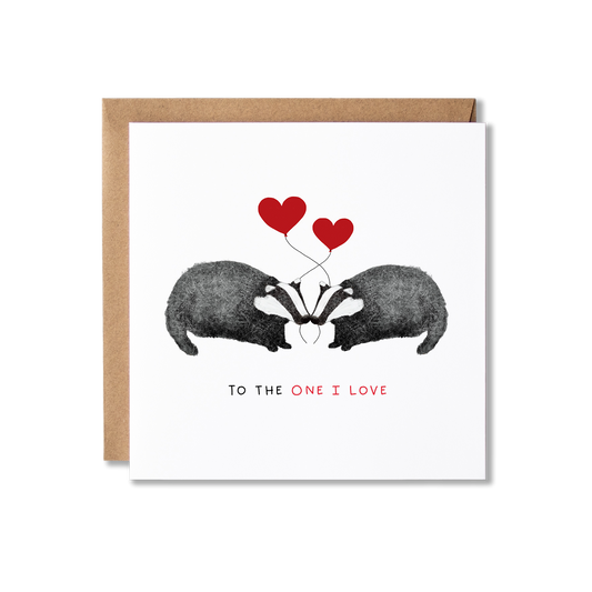 Greeting card with illustration of a badger couple each holding red hear balloons with the message To the One I Love.
