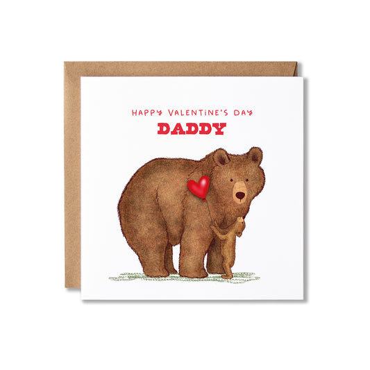A Valentine's Day card featuring an illustration of a brown bear holding a small cub and a red heart, with the text 'HAPPY VALENTINE'S DAY DADDY' in red, shown with a brown kraft envelope on a white background.