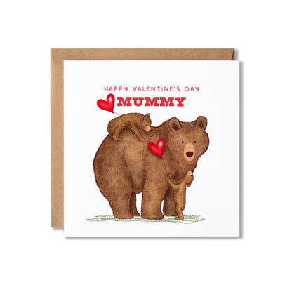 A square Valentine's Day greeting card with a brown kraft envelope behind it. The card features an illustration of a mother bear and her two cubs, with red hearts and the text 'HAPPY VALENTINE'S DAY MUMMY' in red at the top.
