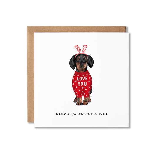 Valentine's Day card with illustration of a Dachshund sausage dog in a red jumper with white hearts and 'Love You' on it and wearing heart bobblers with the message Happy Valentine's Day.