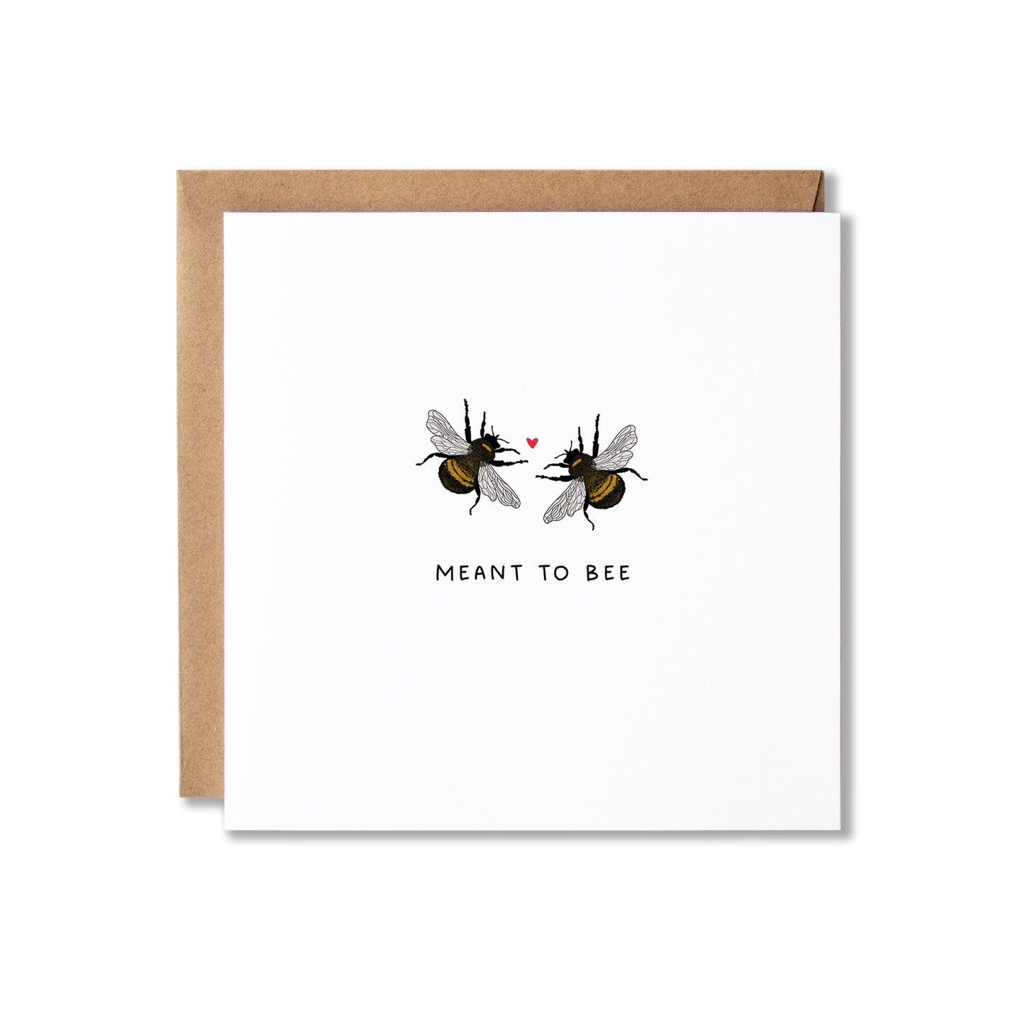 A square white greeting card with a kraft brown envelope behind it, featuring an illustration of two bumblebees facing each other with a small red heart between them and the text 'MEANT TO BEE' below.