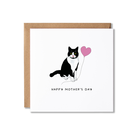 Mother's Day card with illustration of a black and white tuxedo cat holding a pink balloon and the message Happy Mother's Day.