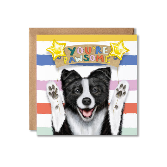 A square greeting card with a brown kraft envelope behind it, featuring a black-and-white Border Collie dog with raised paws and the text 'YOU'RE PAWSOME' under two yellow star balloons on a pastel striped background.
