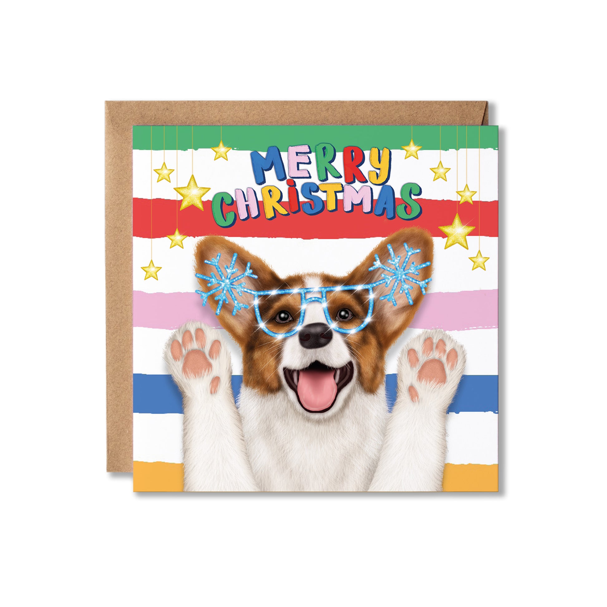 A square Christmas greeting card with a brown envelope behind it, featuring a dog with raised paws wearing blue snowflake glasses, with the text 'MERRY CHRISTMAS' on a striped multicolor background.