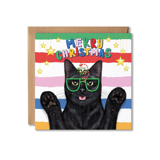 A square Christmas greeting card featuring a black cat wearing green glasses and mistletoe, with colourful striped bands and the words “MERRY CHRISTMAS” across the top with a brown kraft envelope.