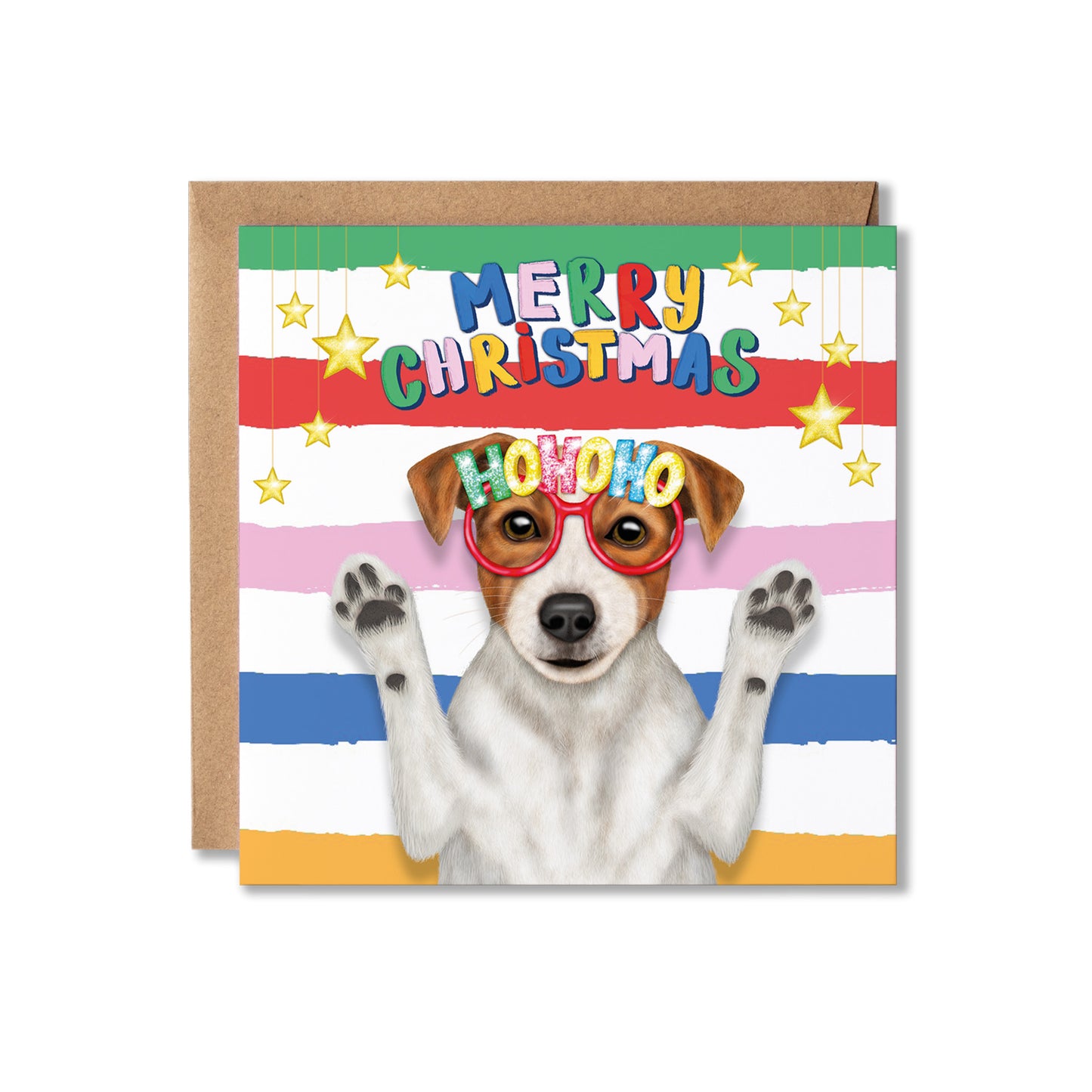 A square Christmas greeting card with a brown kraft envelope behind it. The card features a Jack Russell dog with raised paws wearing red novelty glasses and the word "HOHOHO" on the lenses, set against horizontal rainbow stripes and gold stars with the text "MERRY CHRISTMAS.