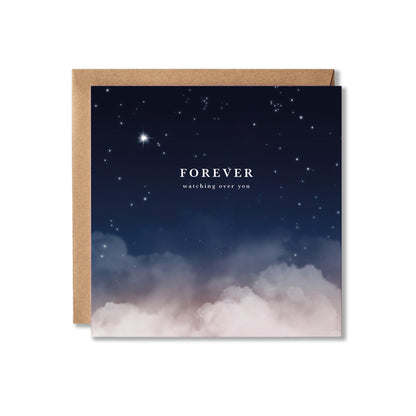 A square greeting card with a kraft paper envelope, featuring a night sky design with stars fading into soft pink and white clouds at the bottom. The card reads 'FOREVER' with 'watching over you' underneath in white text.