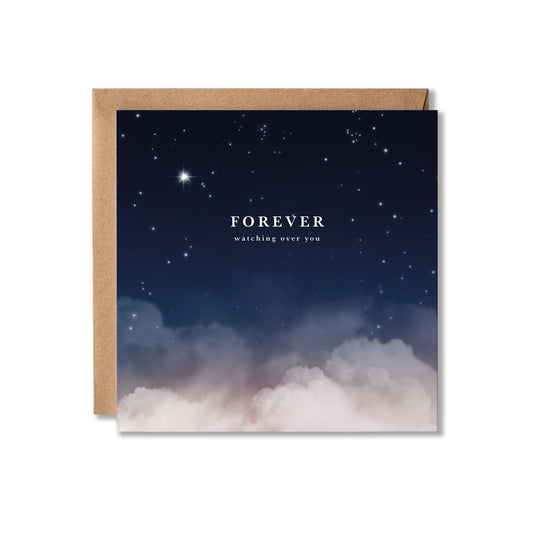 A square greeting card with a kraft paper envelope, featuring a night sky design with stars fading into soft pink and white clouds at the bottom. The card reads 'FOREVER' with 'watching over you' underneath in white text.