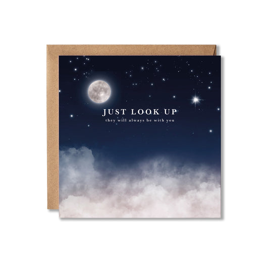 A square greeting card with a kraft paper envelope, featuring a night sky design with a full moon, stars, and clouds, and the text 'JUST LOOK UP they will always be with you'.