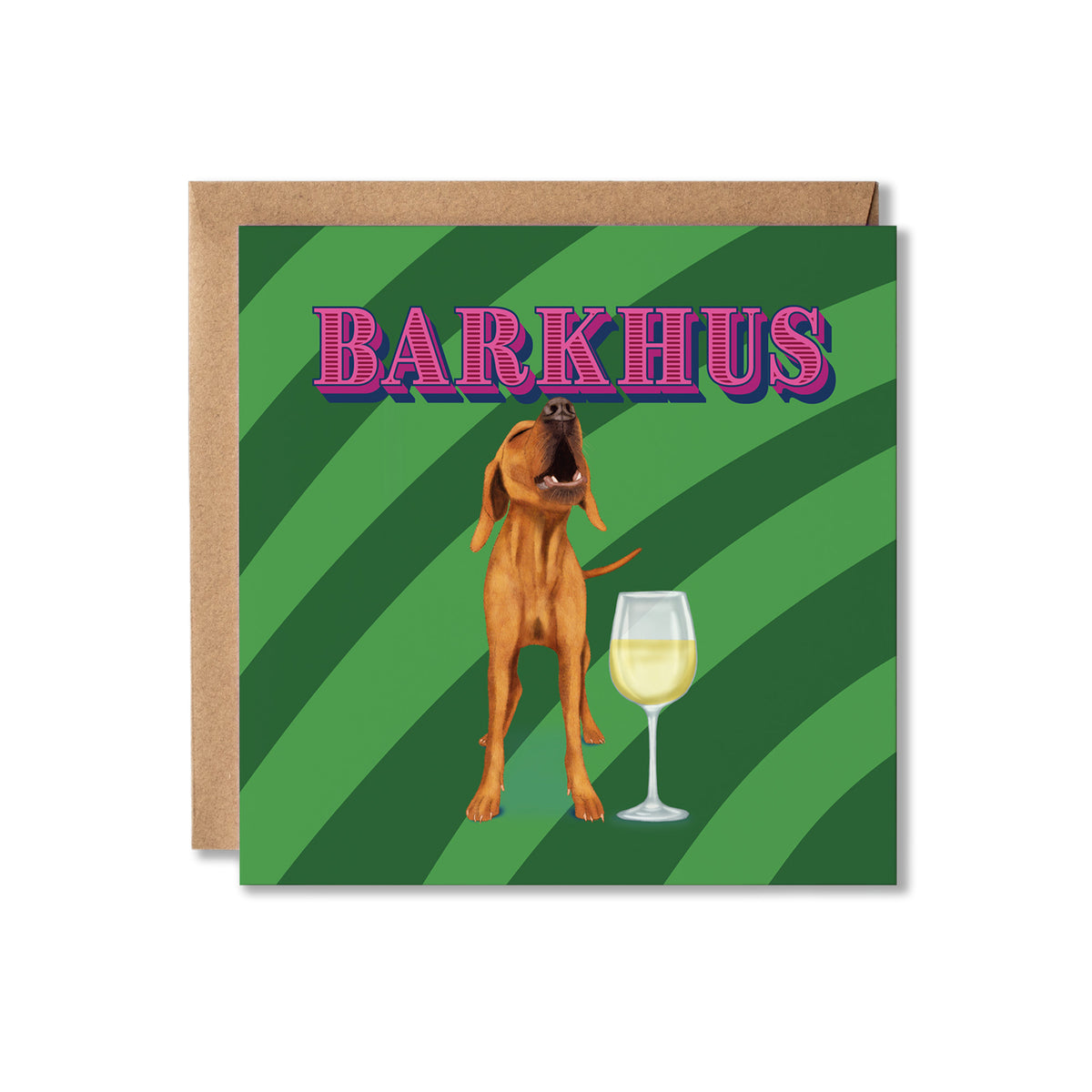 A square greeting card with a kraft envelope behind it, featuring a brown dog standing next to a wine glass on a green striped background, with the word 'BARKHUS' in pink outlined letters at the top.