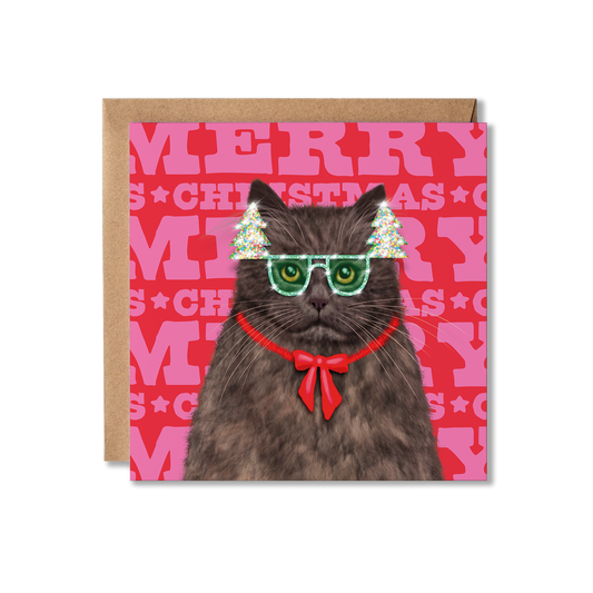 A British Long Hair Cat in Christmas tree glasses and a red bow with a colourful Merry Christmas background