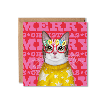 A white and grey cat wearing a yellow knitted star jumper and Ho Ho Ho glasses with a colourful Merry Christmas background